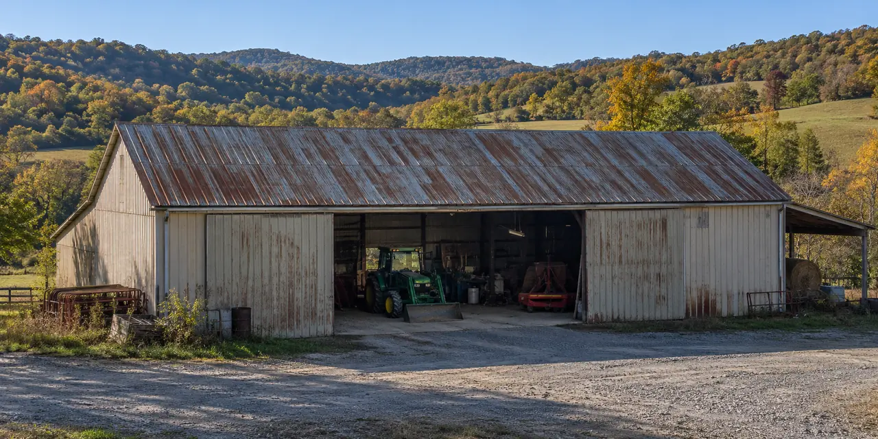 Long commercial metal building roof with gutters along the eave